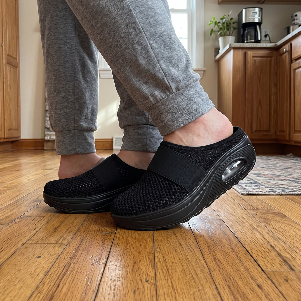 Backless cushioned slippers with air sole in use at home