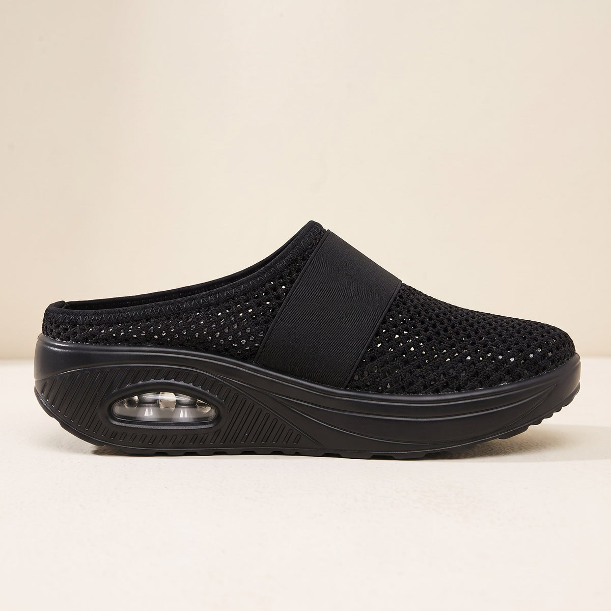 Backless cushioned slippers with air sole close-up detail