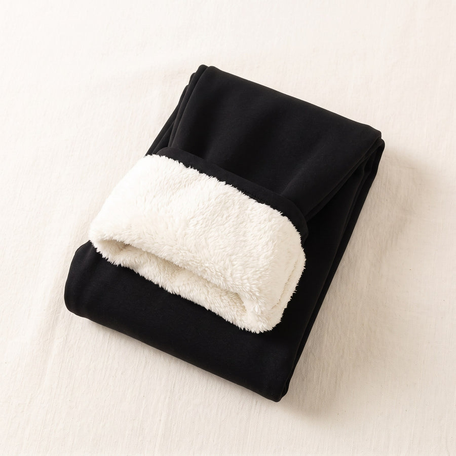 Fleece-lined thermal leggings on a plain background