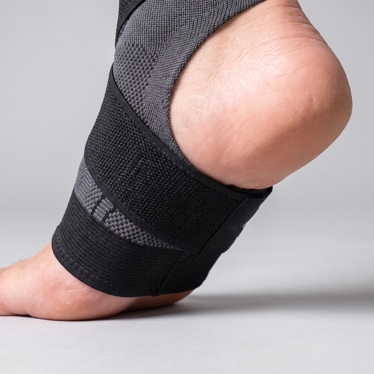 Close-up of the Strydex Foot Sleeve strap supporting the arch and heel