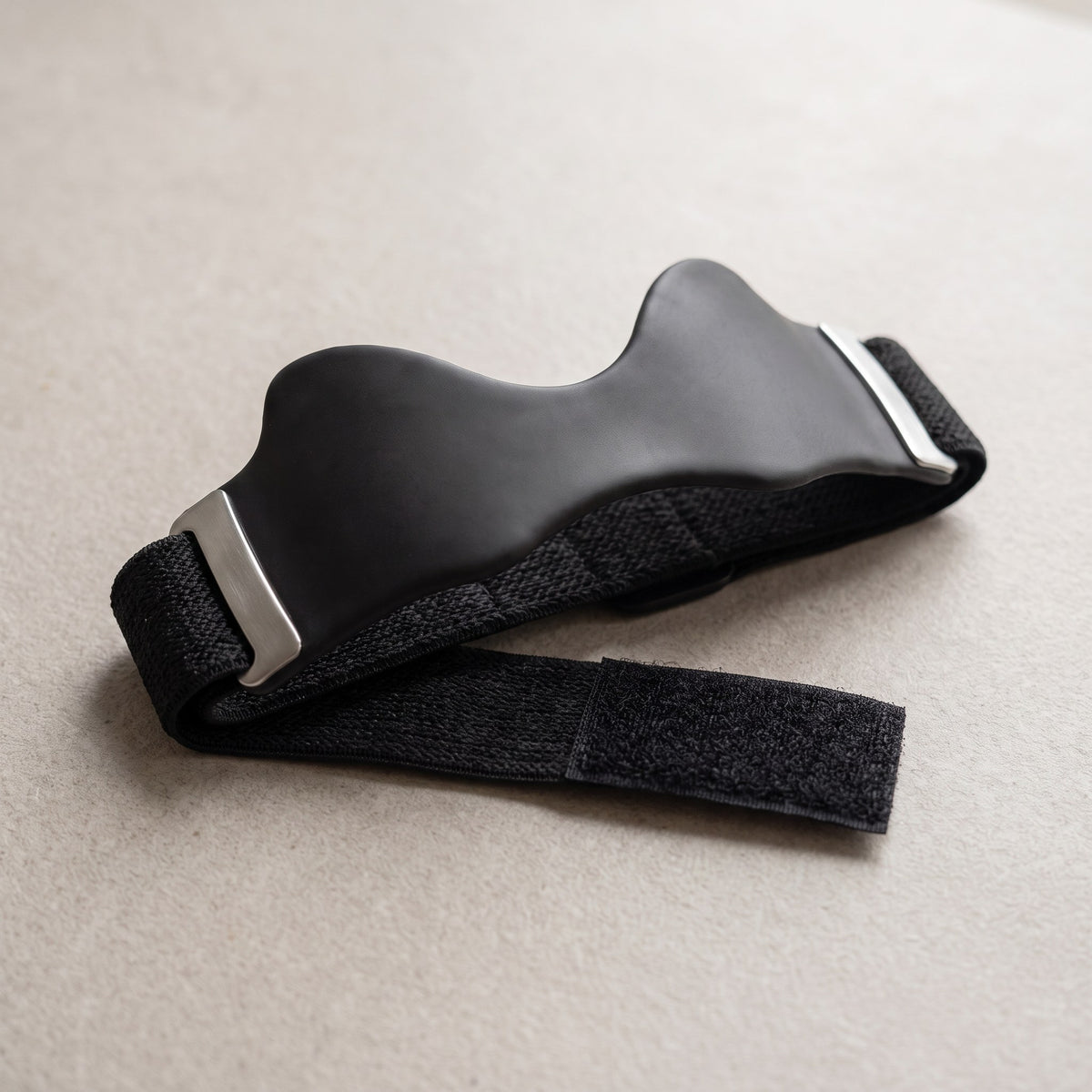 Strydex Precision Strap: curved silicone pad on an adjustable elastic band with hook-and-loop closure