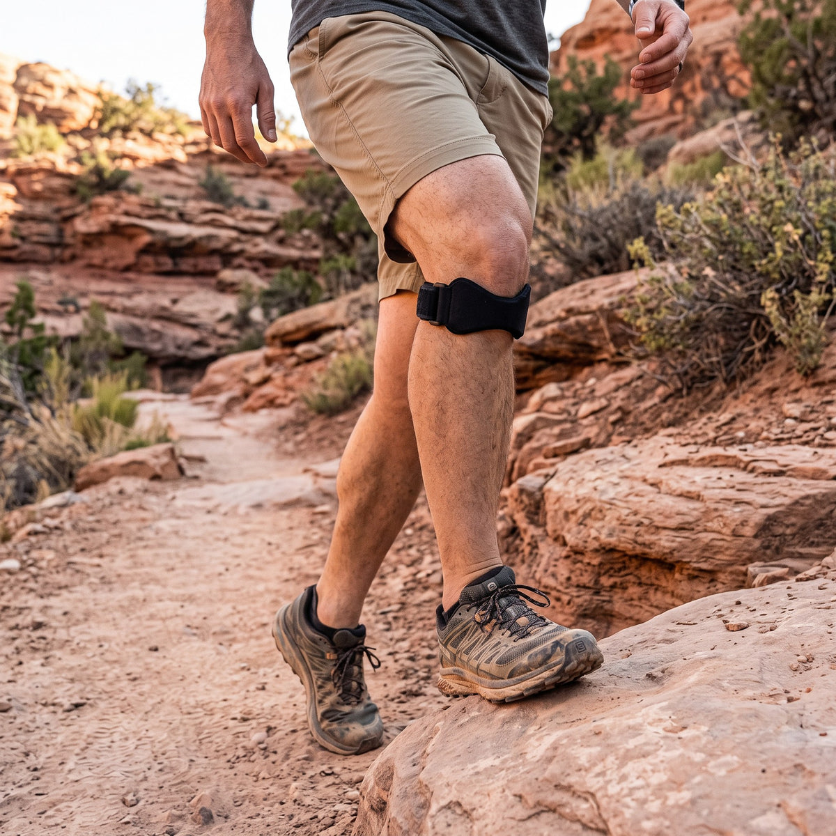 Hiker on a desert trail wearing the Strydex Precision Strap below the kneecap