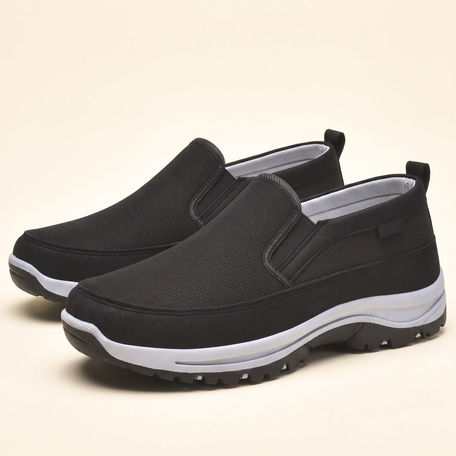 Men's orthopedic slip-on shoes on a plain background