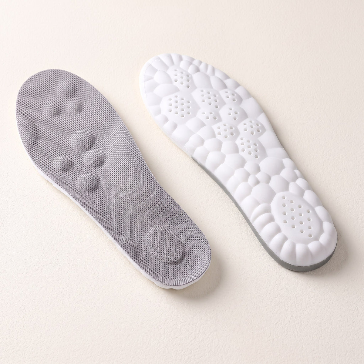 OrtoCloud 4D insoles on a plain background
