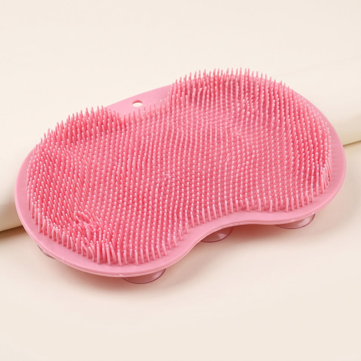 Shower foot scrubber mat on a plain background